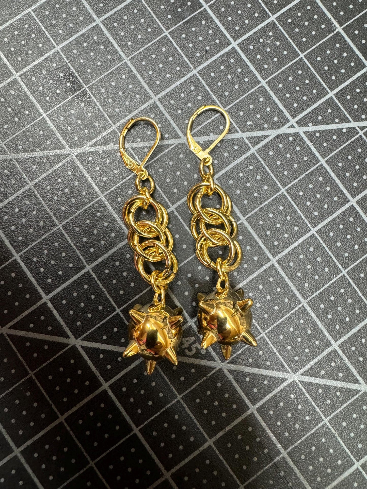Gold flail earrings