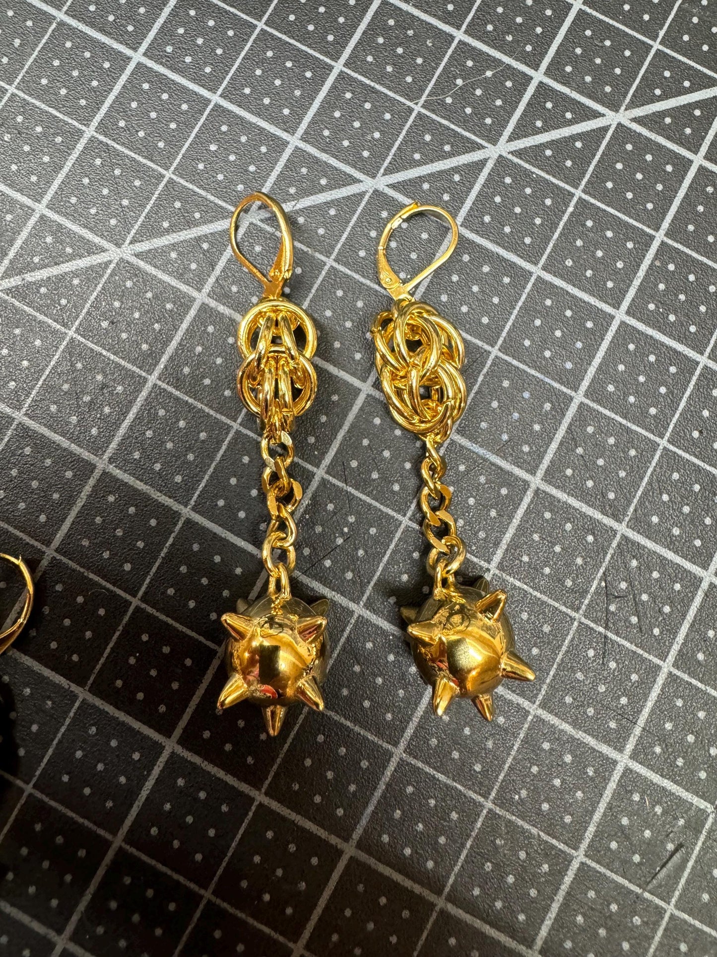 Gold flail earrings