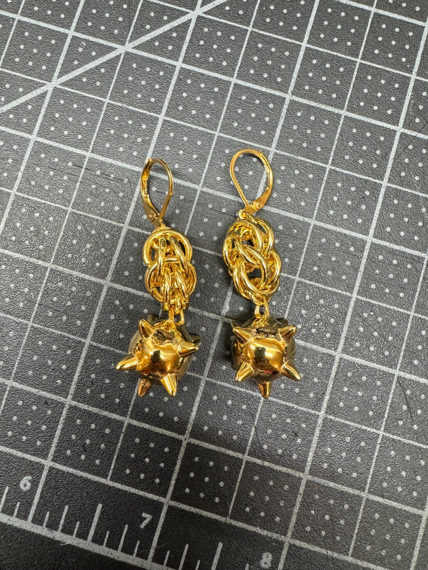 Gold flail earrings