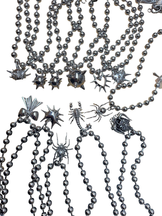 Ball chains, pendant chains, mace, hearts, spiders, medieval themed
