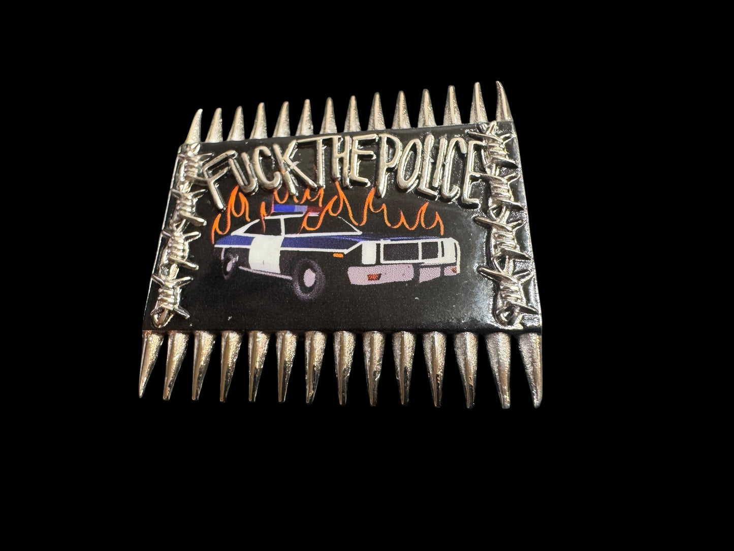 burning cop car pin