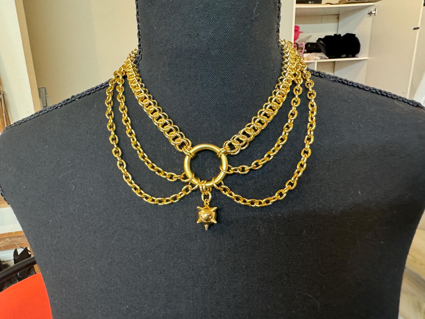 Gold flail, mace, necklace